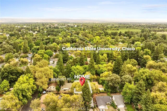 an aerial view of residential houses with outdoor space