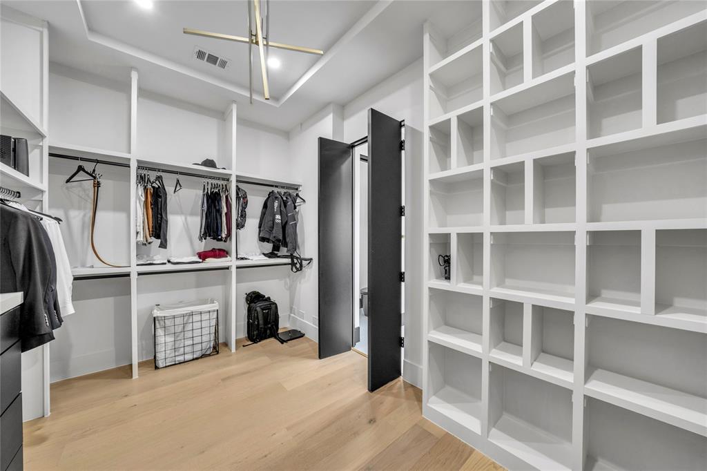 4721 Linnet Lane Dallas, TX 75209 - Photo 18 of 40 a view of walk in closet with empty racks
