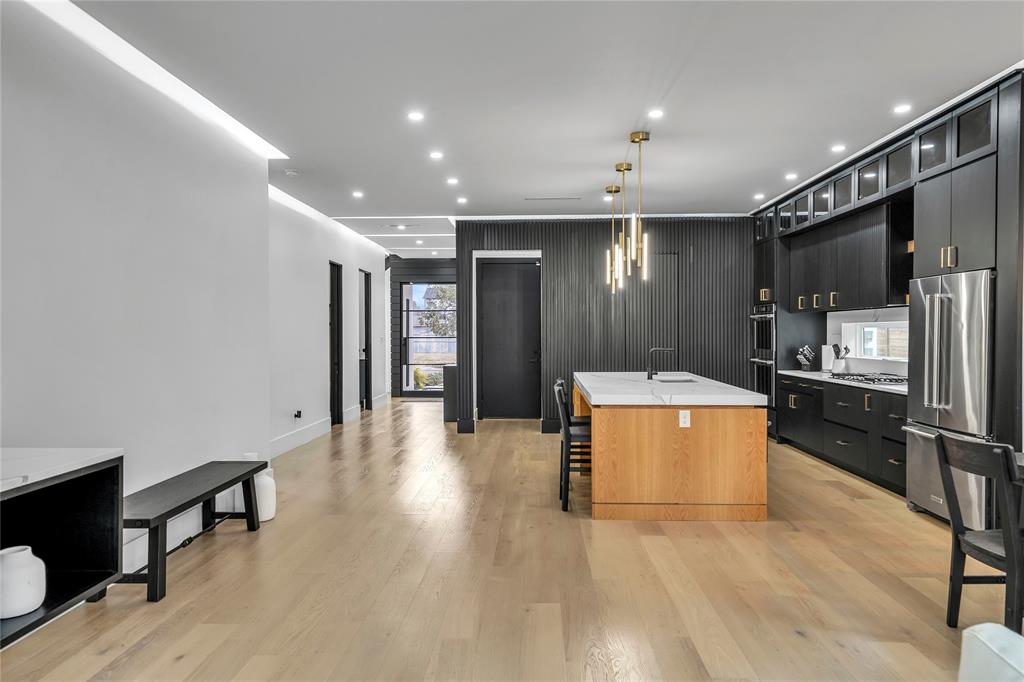4721 Linnet Lane Dallas, TX 75209 - Photo 2 of 40 a view of kitchen with refrigerator microwave and cabinets