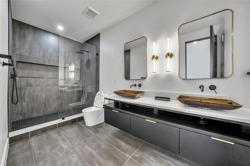 4721 Linnet Lane Dallas, TX 75209 - Photo 31 of 40 a bathroom with a double vanity sink and a mirror