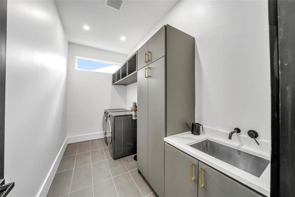 4721 Linnet Lane Dallas, TX 75209 - Photo 36 of 40 a kitchen with a sink and stainless steel appliances