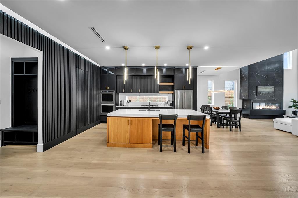 4721 Linnet Lane Dallas, TX 75209 - Photo 5 of 40 a large kitchen with a table and chairs
