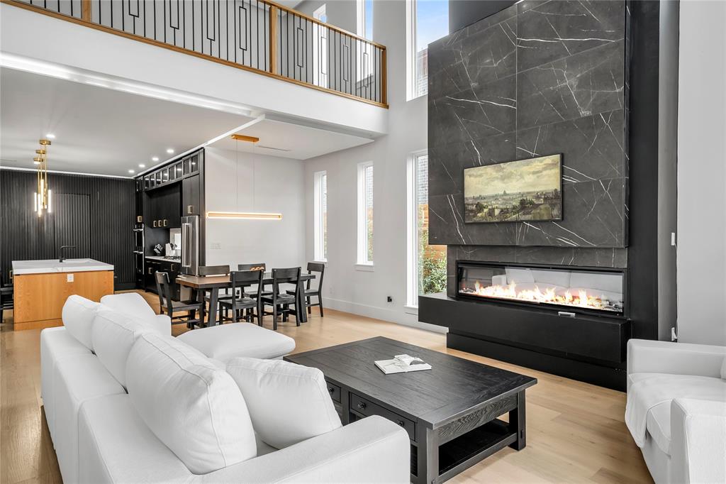 4721 Linnet Lane Dallas, TX 75209 - Photo 8 of 40 a living room with furniture and a flat screen tv