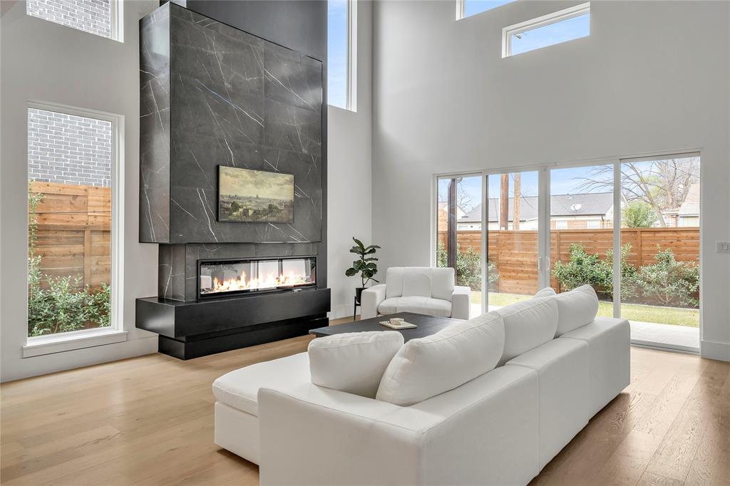 4721 Linnet Lane Dallas, TX 75209 - Photo 9 of 40 a living room with furniture and a floor to ceiling window