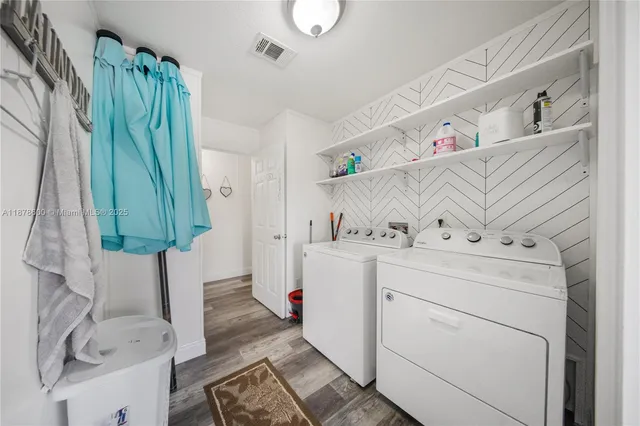 a utility room with dryer and washer