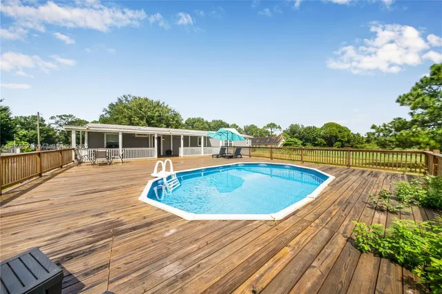 a view of a house with swimming pool