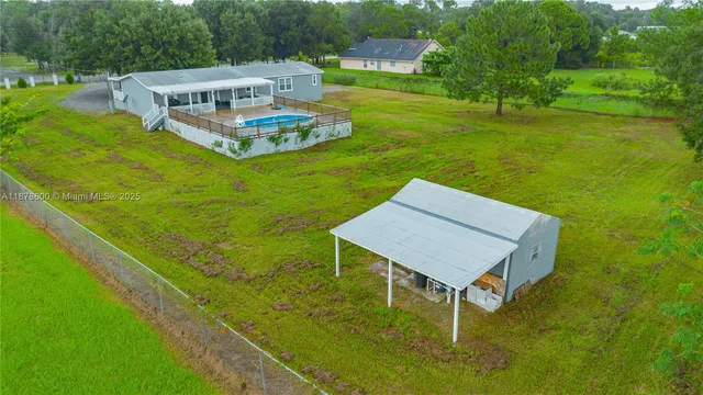 a view of a house with big yard