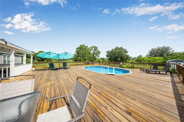 a view of a swimming pool with a patio