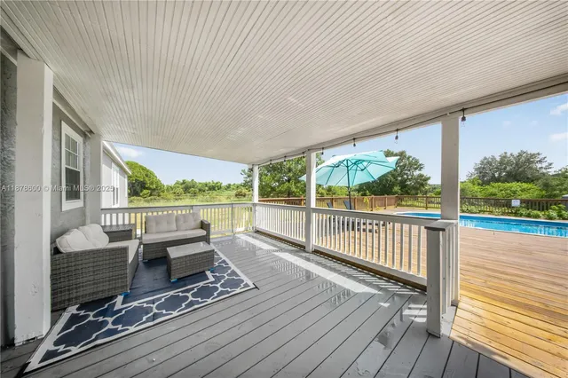 a view of a balcony with chairs