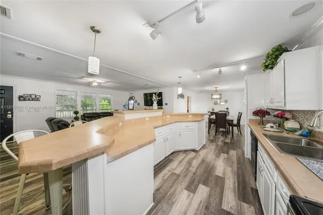 a kitchen with stainless steel appliances kitchen island a large island in the center