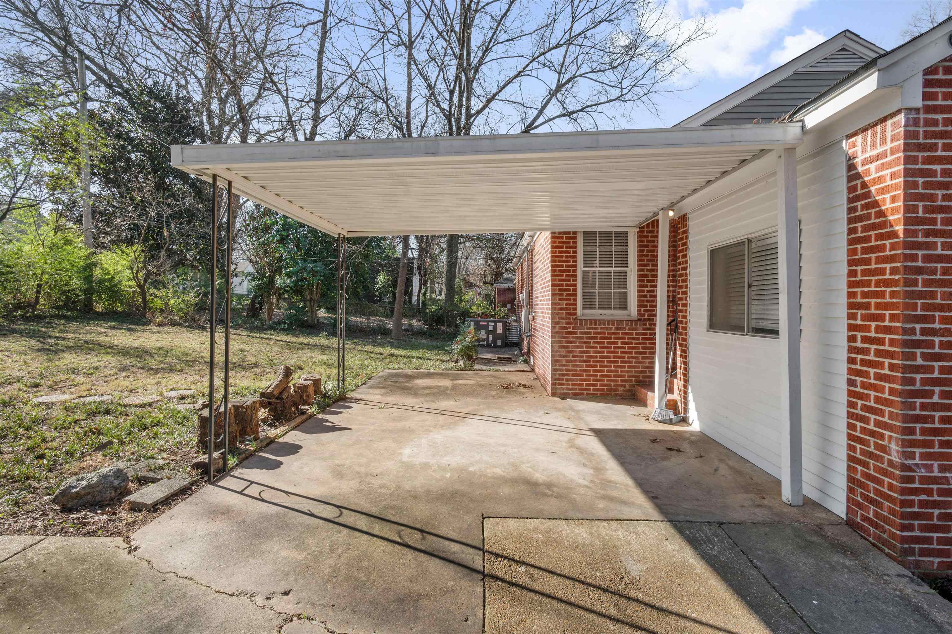 3753 Friar Tuck Road Memphis, TN 38111 - Photo 21 of 21 a view of a house with backyard and trees