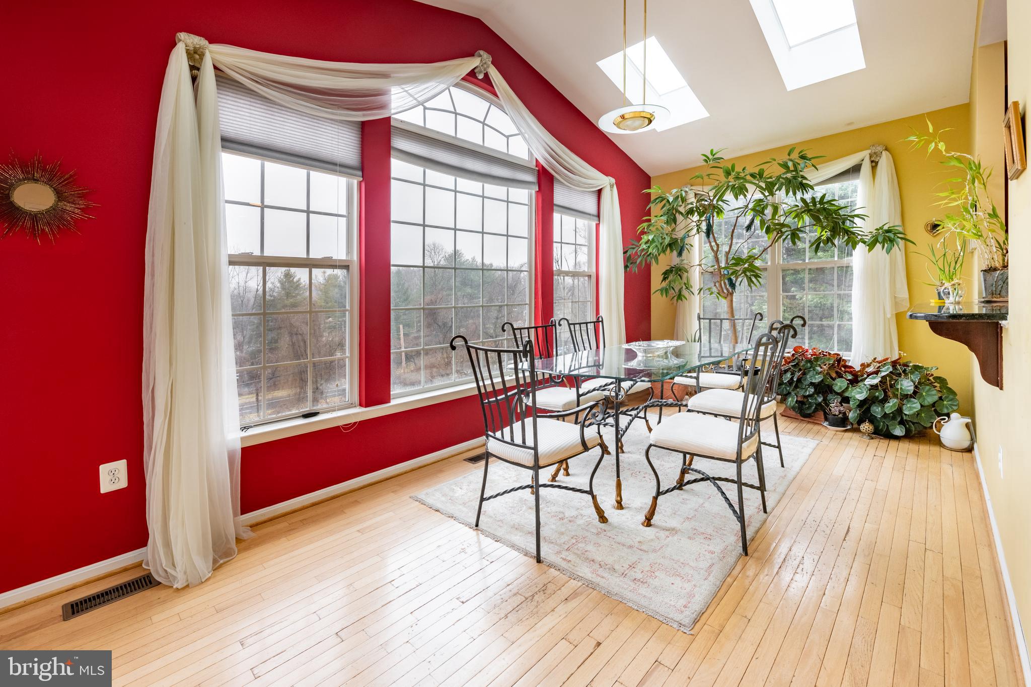 11 Manor Spring Court Silver Spring, MD 20906 - Photo 11 of 45 a view of a dining room with furniture a chandelier and wooden floor