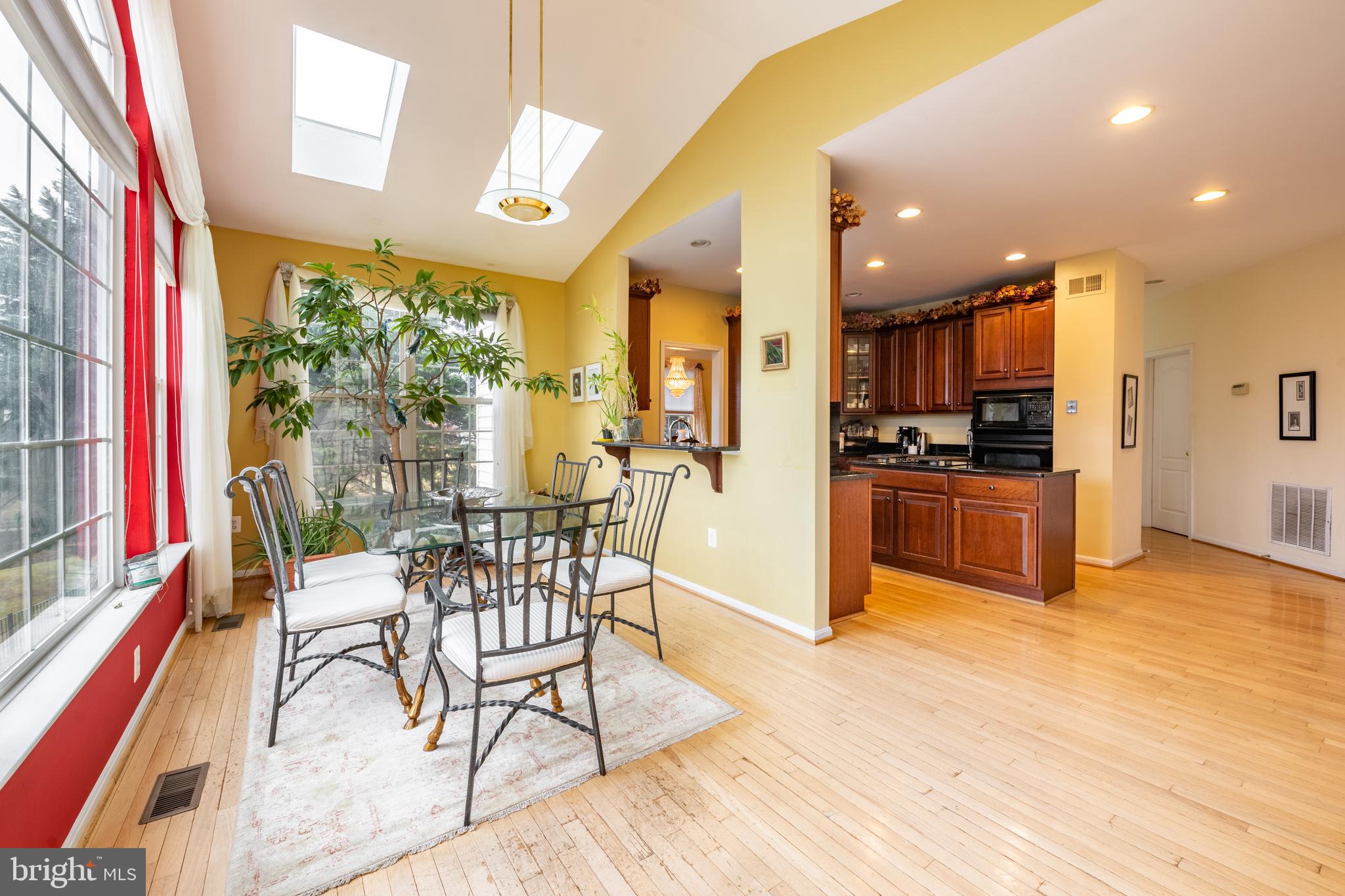 11 Manor Spring Court Silver Spring, MD 20906 - Photo 13 of 45 a view of a dining room with furniture and a kitchen