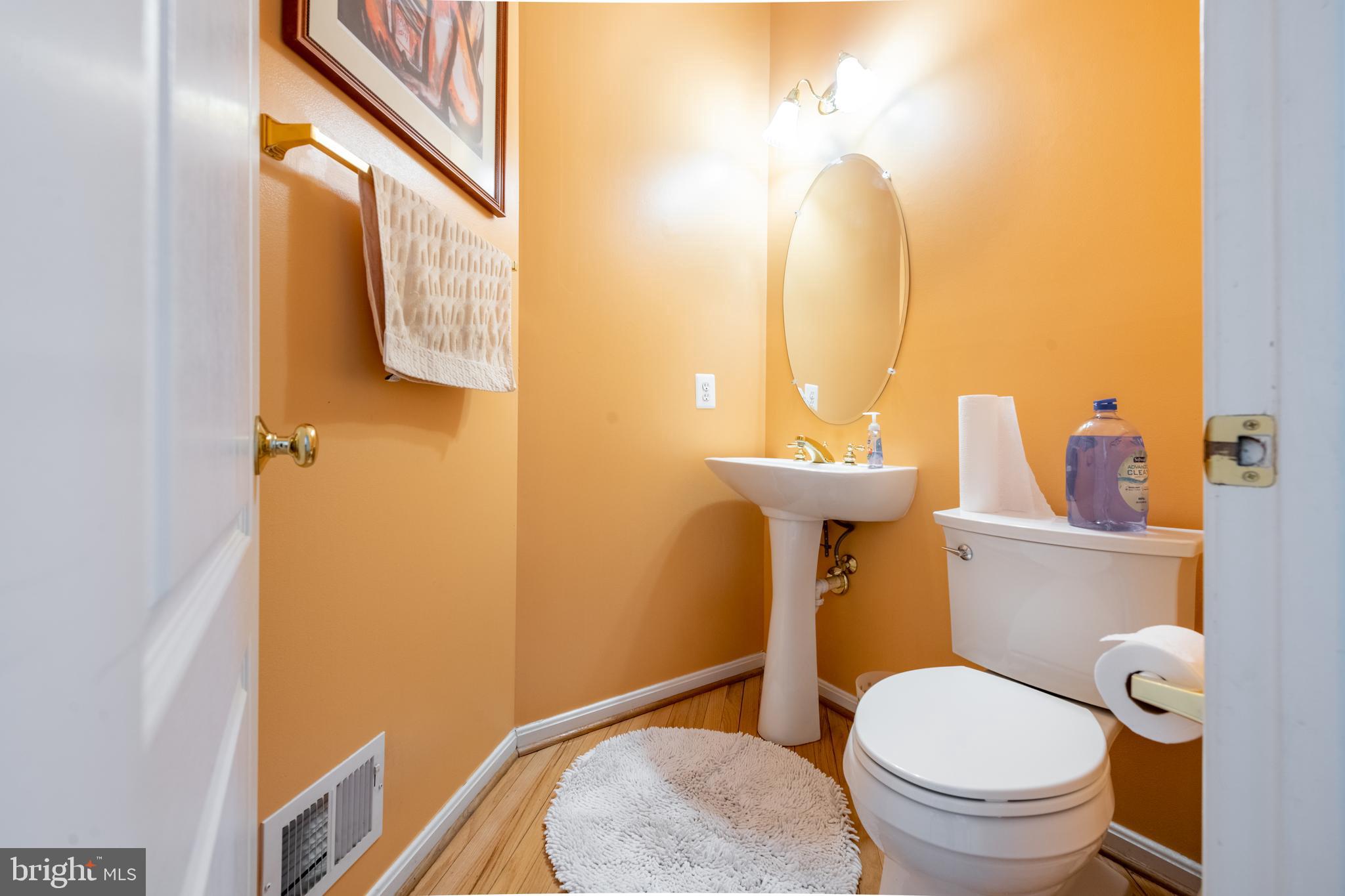 11 Manor Spring Court Silver Spring, MD 20906 - Photo 20 of 45 a bathroom with a sink mirror and toilet