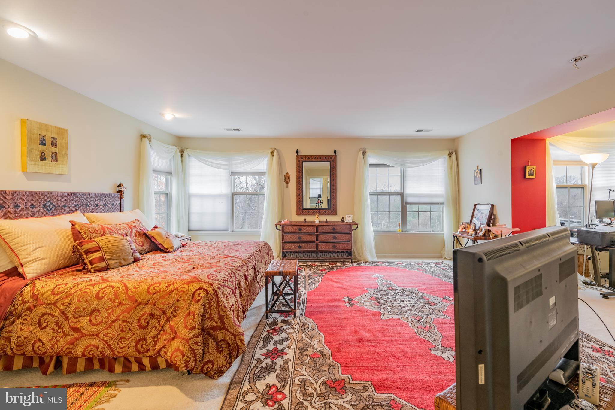 11 Manor Spring Court Silver Spring, MD 20906 - Photo 30 of 45 a bedroom with a large bed and a dresser
