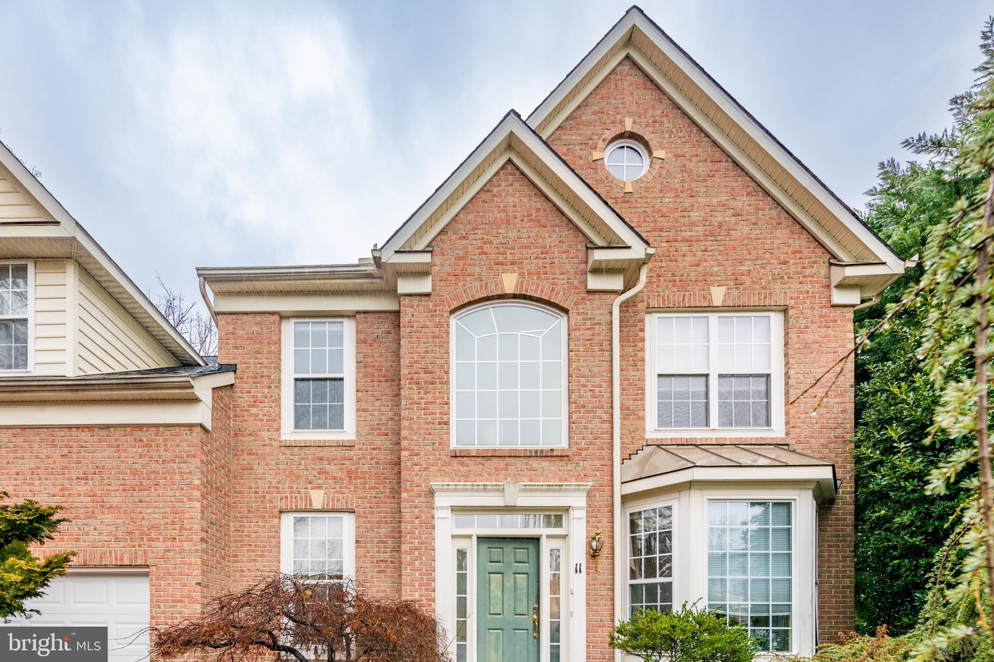 11 Manor Spring Court Silver Spring, MD 20906 - Photo 44 of 45 a view of a brick house with large windows