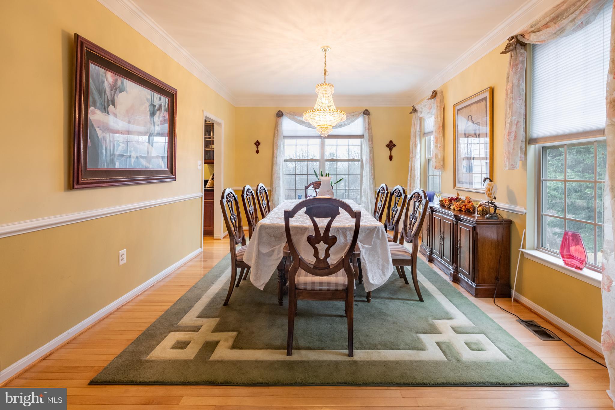 11 Manor Spring Court Silver Spring, MD 20906 - Photo 5 of 45 a dining room with furniture a rug and wooden floor
