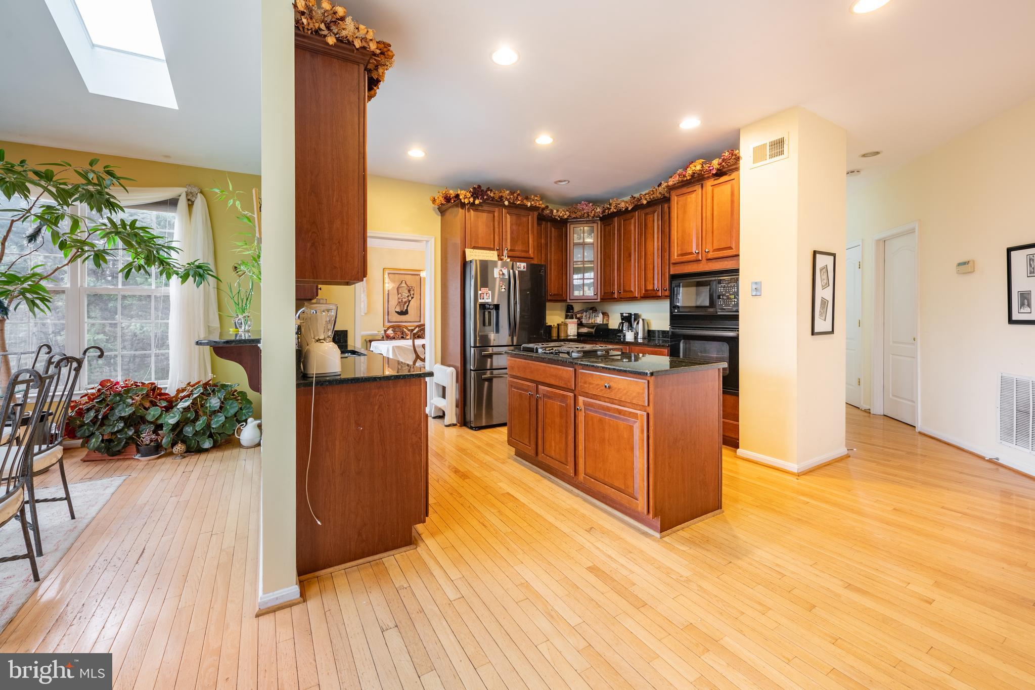 11 Manor Spring Court Silver Spring, MD 20906 - Photo 10 of 45 a kitchen with stainless steel appliances a stove top oven a sink and a refrigerator