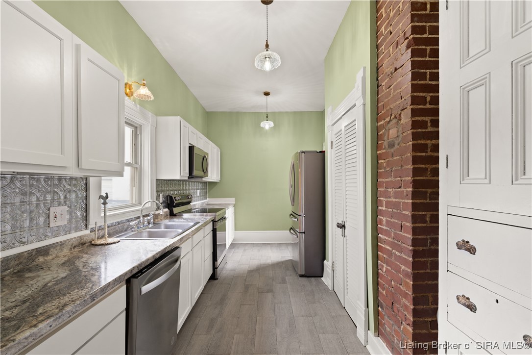 427 East Chestnut Street Corydon, IN 47112 - Photo 2 of 63 Kitchen w/ pantry closet and pantry hutch. Stainless steel appliances. Rear entry door here also.