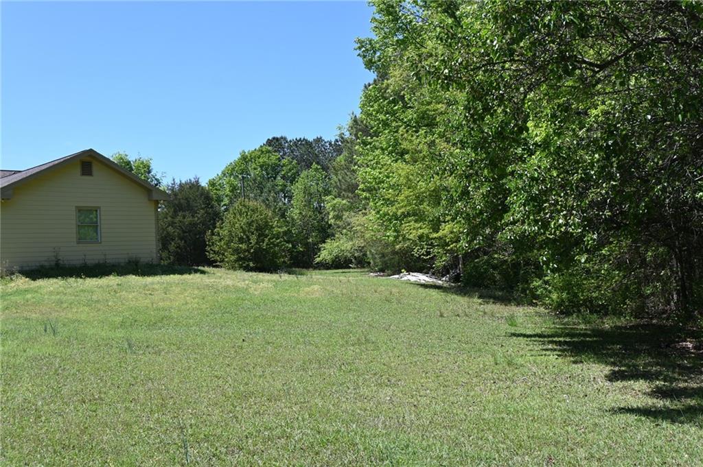 2755 Langley Road Southwest Loganville, GA 30052 - Photo 11 of 49 a backyard of a house with lots of green space