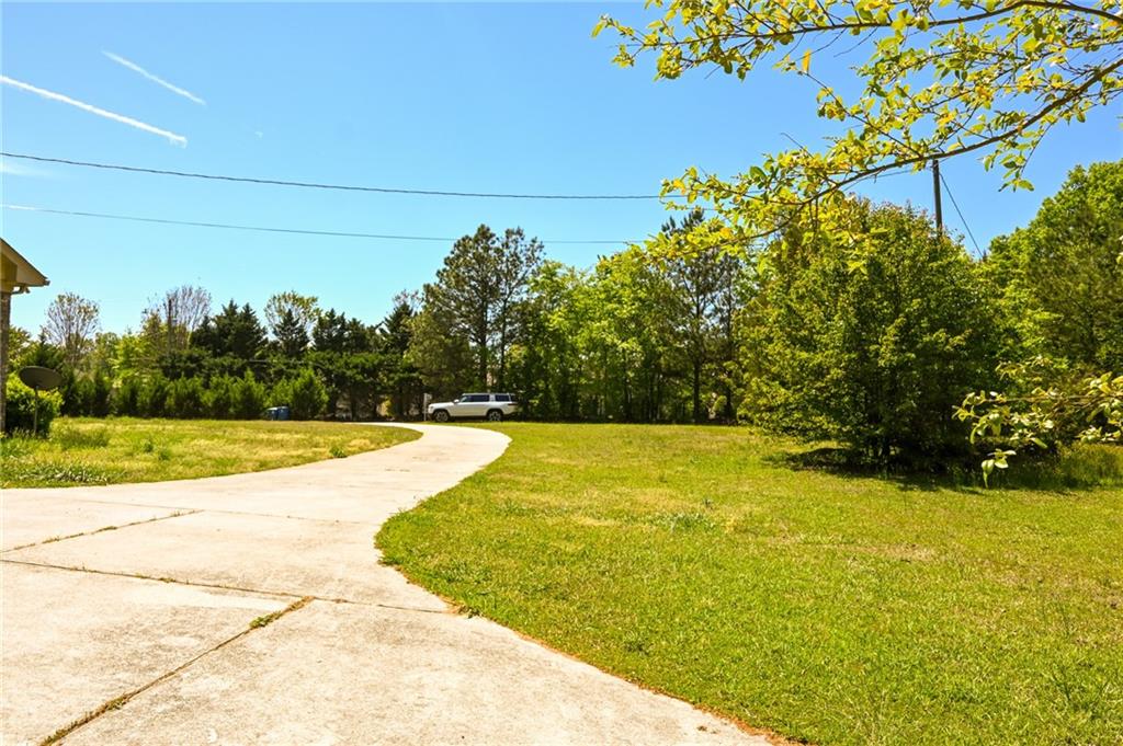 2755 Langley Road Southwest Loganville, GA 30052 - Photo 16 of 49 a view of swimming pool with an outdoor space