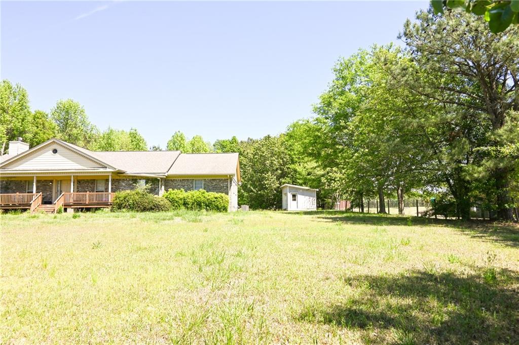 2755 Langley Road Southwest Loganville, GA 30052 - Photo 2 of 49 a front view of a house with a yard