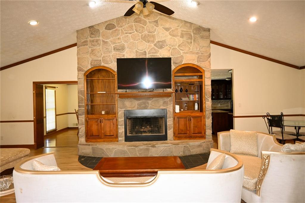 2755 Langley Road Southwest Loganville, GA 30052 - Photo 26 of 49 a living room with furniture and a fireplace