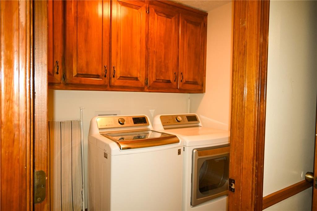 2755 Langley Road Southwest Loganville, GA 30052 - Photo 30 of 49 a utility room with dryer and washer