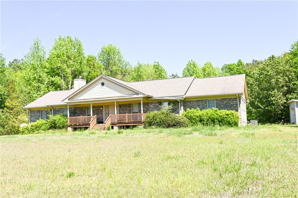 2755 Langley Road Southwest Loganville, GA 30052 - Photo 3 of 49 a front view of a house with yard and green space