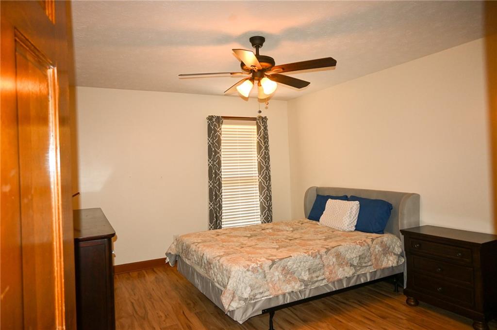 2755 Langley Road Southwest Loganville, GA 30052 - Photo 34 of 49 a bedroom with a bed and a window