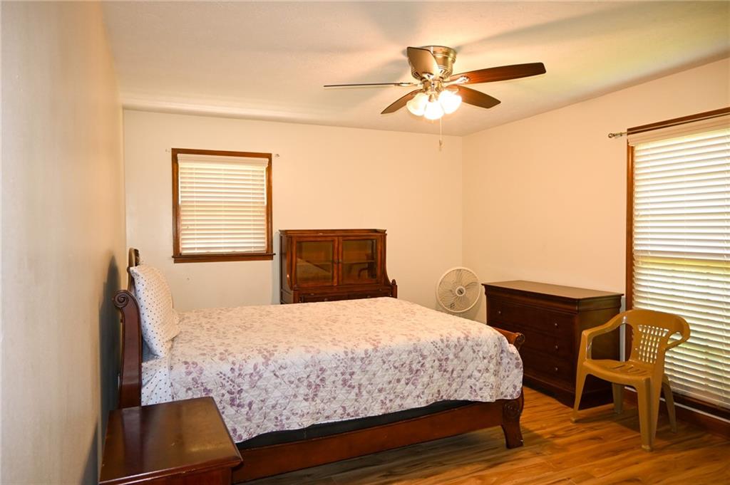 2755 Langley Road Southwest Loganville, GA 30052 - Photo 39 of 49 a bedroom with a bed and a chair