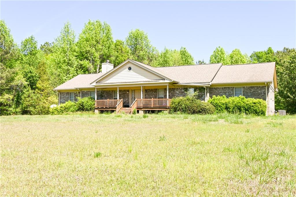 2755 Langley Road Southwest Loganville, GA 30052 - Photo 4 of 49 a house with swimming pool in front of it