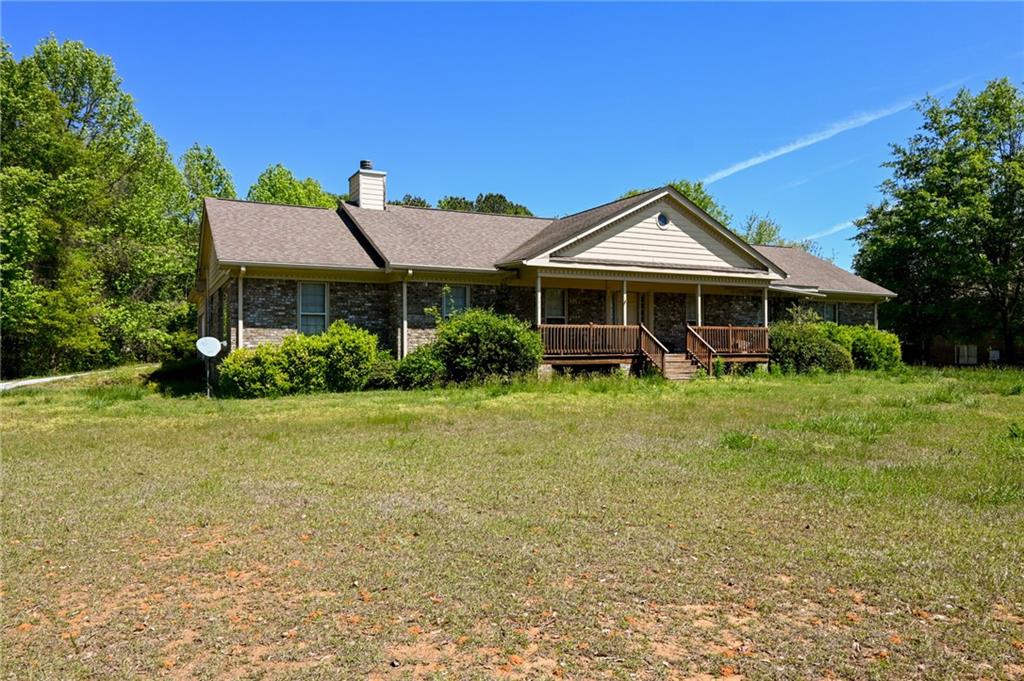 2755 Langley Road Southwest Loganville, GA 30052 - Photo 46 of 49 a front view of a house with garden