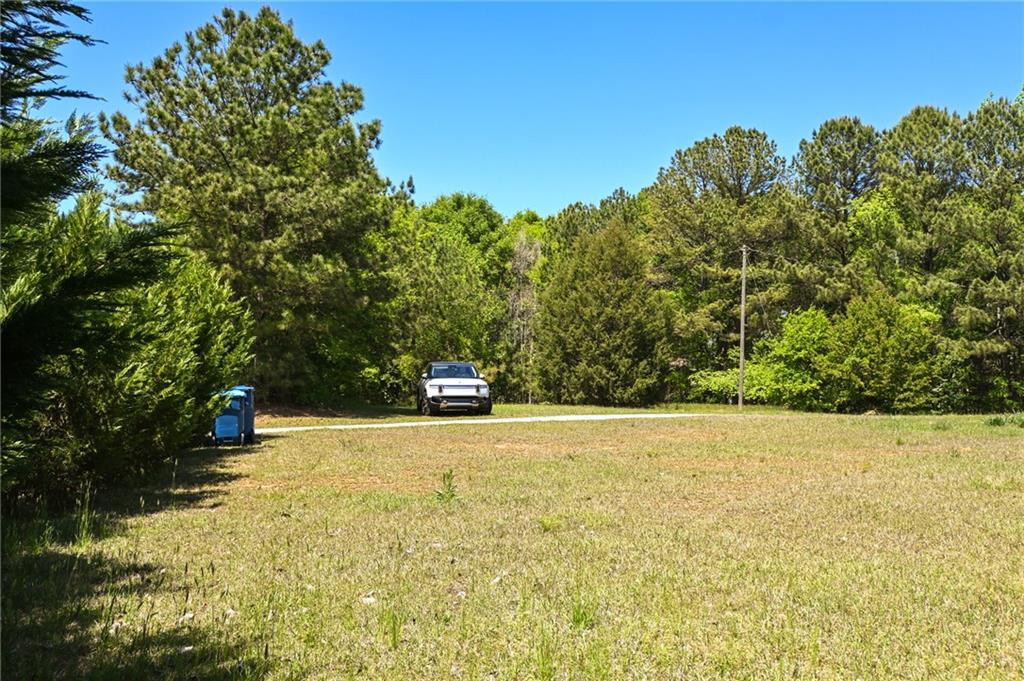 2755 Langley Road Southwest Loganville, GA 30052 - Photo 5 of 49 a view of a field with trees in the background