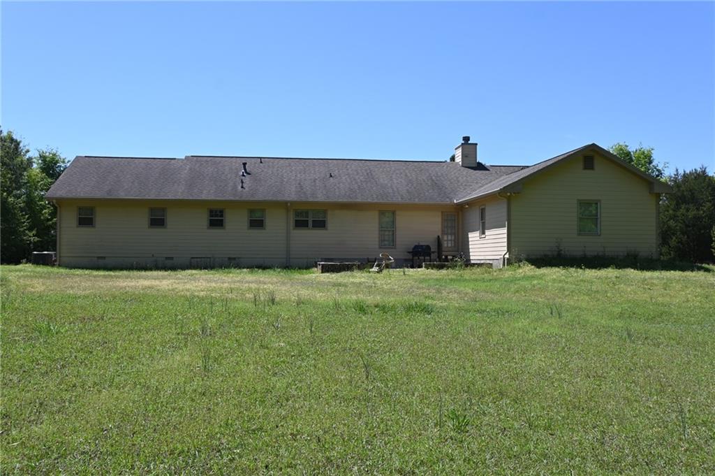 2755 Langley Road Southwest Loganville, GA 30052 - Photo 10 of 49 a front view of a house with a garden