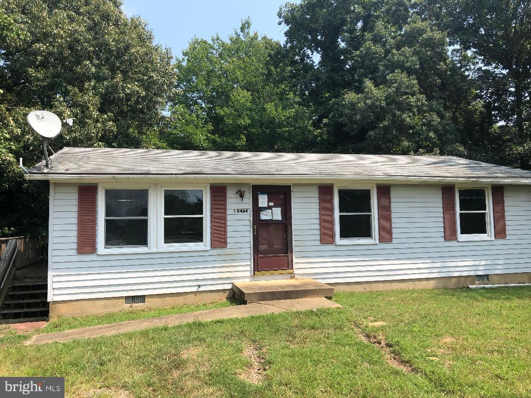 12484 Rousby Hall Road Lusby, MD 20657 - Photo 1 of 11 a view of a house with a backyard