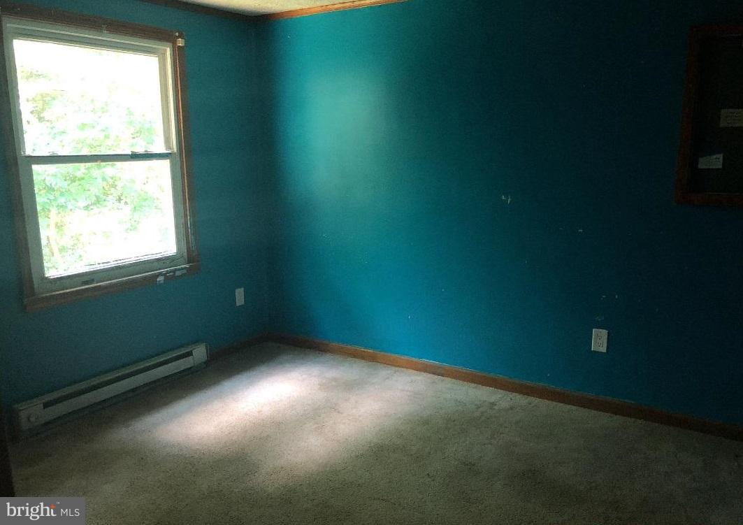 12484 Rousby Hall Road Lusby, MD 20657 - Photo 4 of 11 an empty room with a window