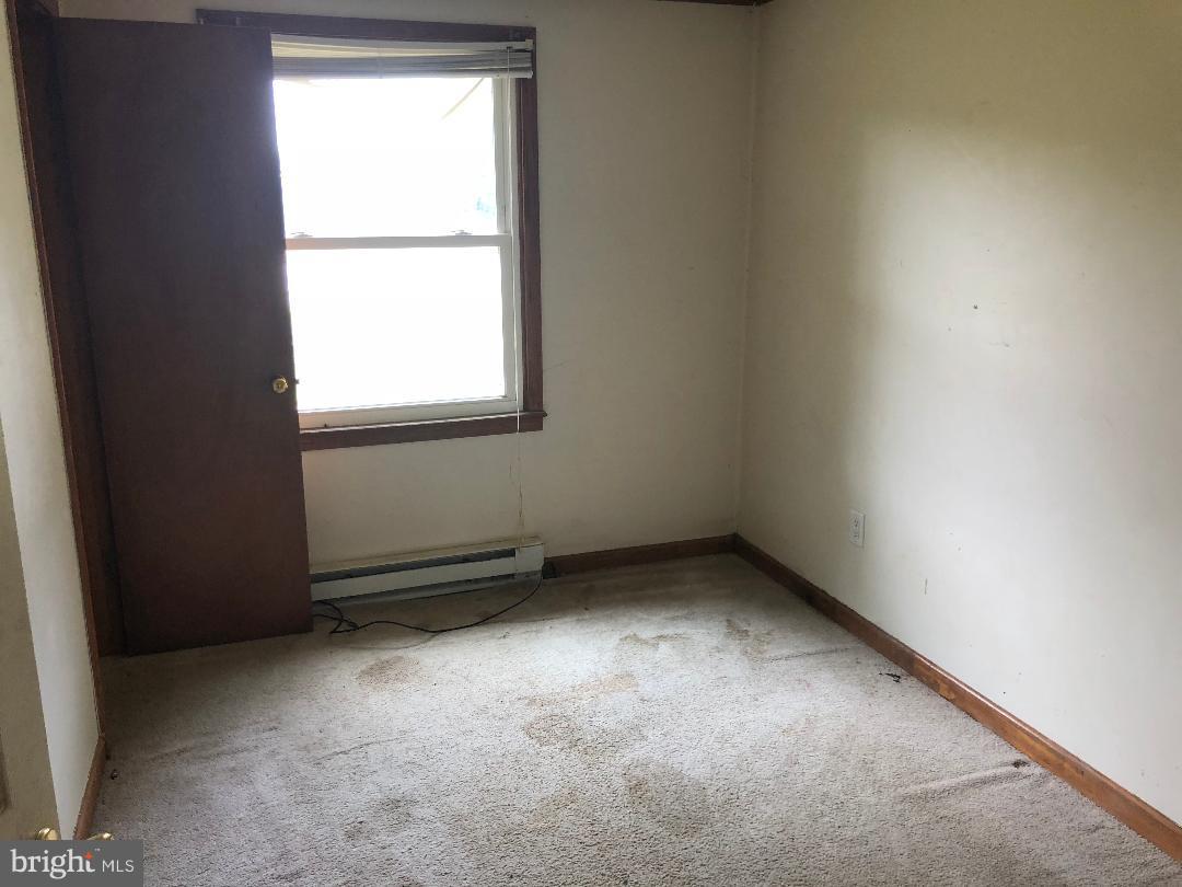 12484 Rousby Hall Road Lusby, MD 20657 - Photo 5 of 11 an empty room with a window