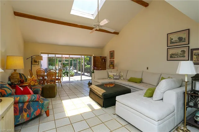 a living room with furniture and flat screen tv