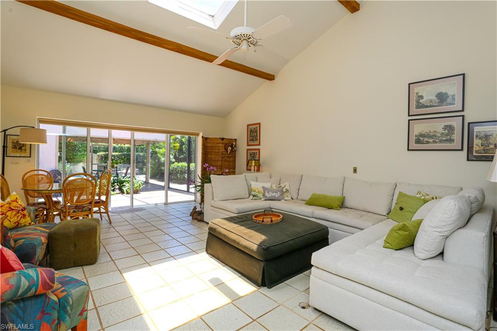 550 3rd Avenue North Naples, FL 34102 - Photo 15 of 48 a living room with furniture and floor to ceiling windows