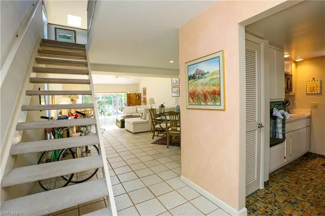 a view of a room with workspace and windows