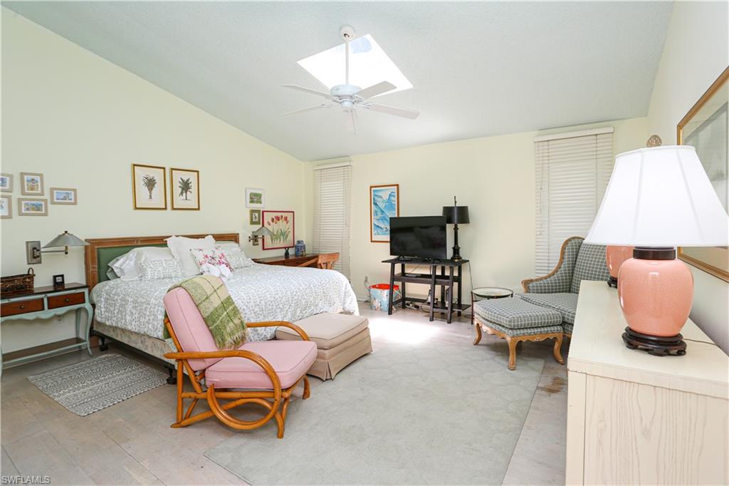 550 3rd Avenue North Naples, FL 34102 - Photo 26 of 48 a bedroom with furniture and a bed