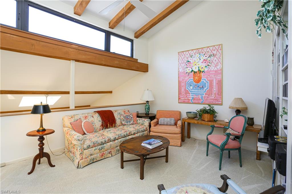 550 3rd Avenue North Naples, FL 34102 - Photo 30 of 48 a living room with furniture a rug and a window