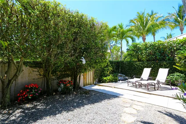 a view of a backyard with sitting area and furniture