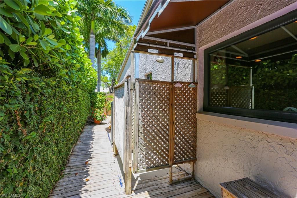 550 3rd Avenue North Naples, FL 34102 - Photo 48 of 48 a view of a wooden door with an outdoor space