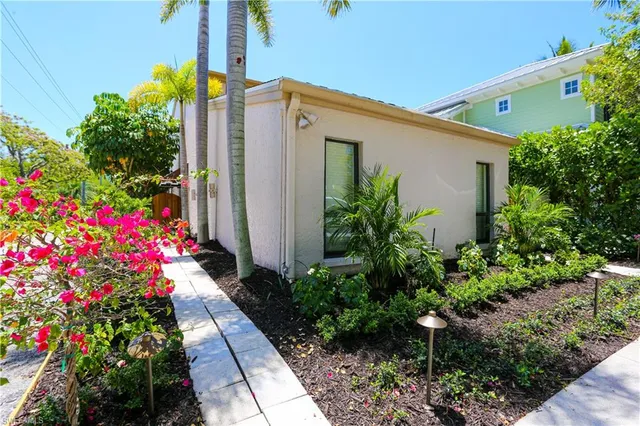 a front view of house and flowers