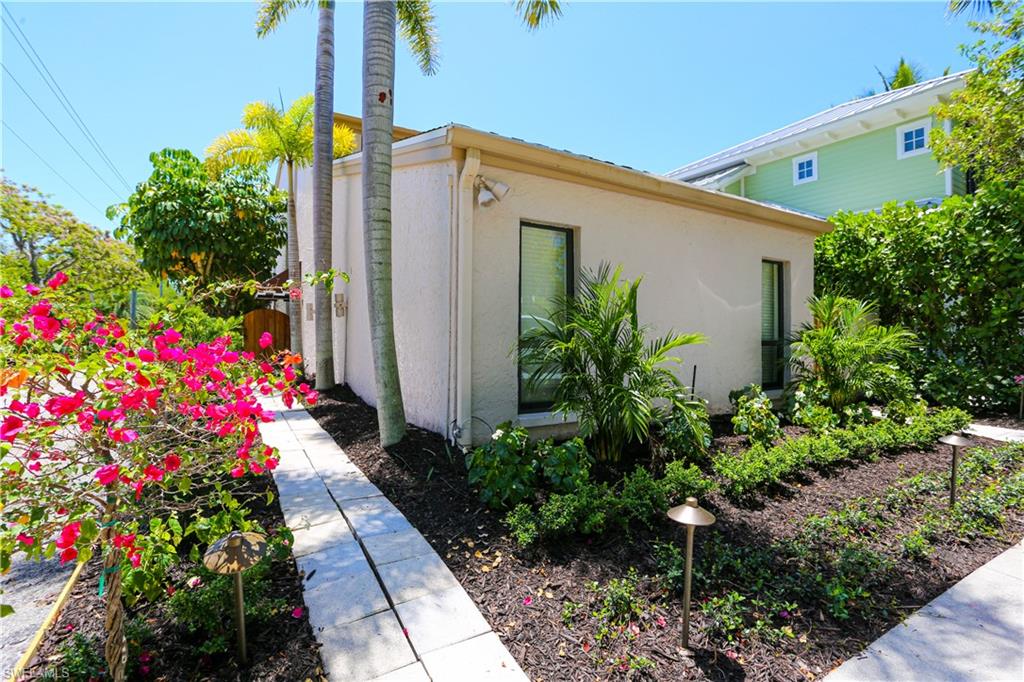 550 3rd Avenue North Naples, FL 34102 - Photo 5 of 48 a front view of house and flowers