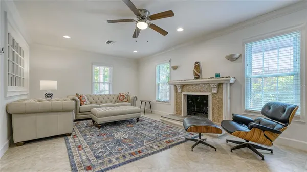a living room with furniture and a fireplace