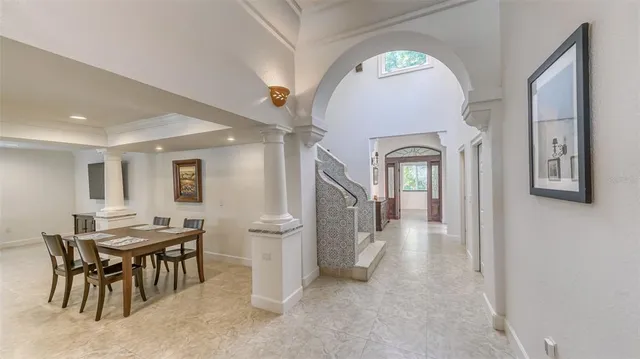 a view of hall way with furniture