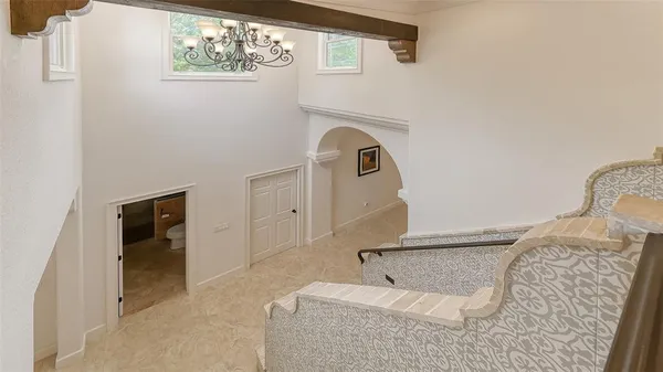 a bedroom with a bed and a table